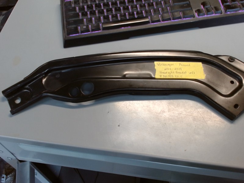 Left Front Headlight Bracket (no box) Left Front Headlight Bracket (no box)